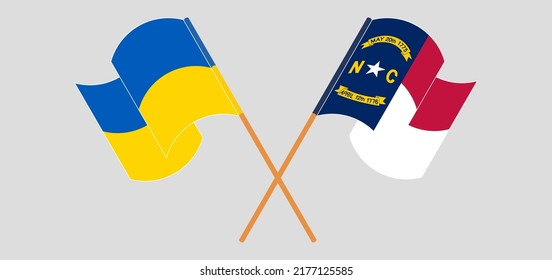 Crossed and waving flags of Ukraine and The State of North Carolina. Vector illustration
