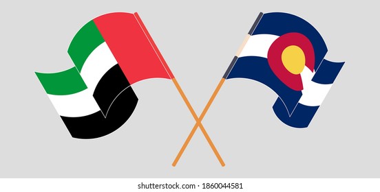 Überquerte und schwellende Flaggen der Vereinigten Arabischen Emirate und des Staates Colorado