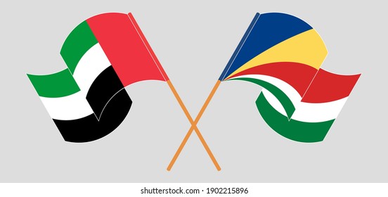 Crossed and waving flags of the United Arab Emirates and Seychelles