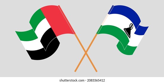 Crossed and waving flags of the United Arab Emirates and Kingdom of Lesotho. Vector illustration

