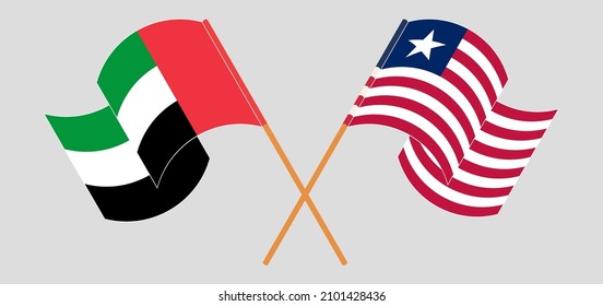 Crossed and waving flags of the United Arab Emirates and Liberia. Vector illustration
