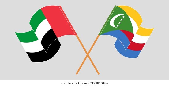 Crossed and waving flags of the United Arab Emirates and Comoros. Vector illustration
