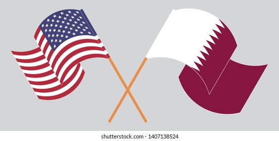 Crossed and waving flags of the USA and Qatar