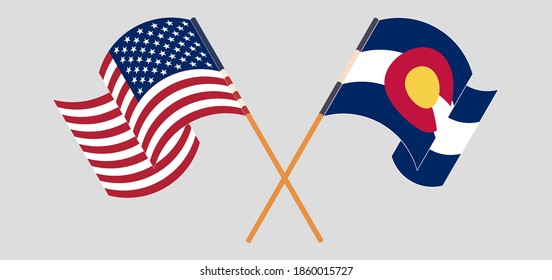 Crossed and waving flags of The USA and The State of Colorado