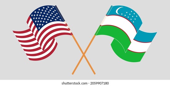 Crossed and waving flags of the USA and Uzbekistan