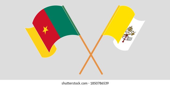 Crossed and waving flags of Vatican and Cameroon