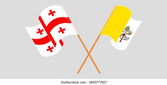 Banderas cruzadas y ondeando banderas del Vaticano y Georgia