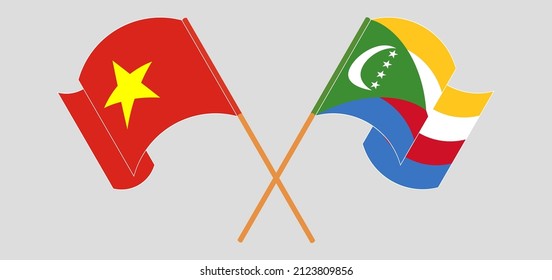Überquerte und schwellende Flaggen von Vietnam und den Komoren. Vektorgrafik
