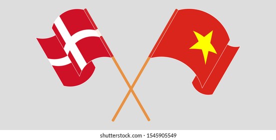 Crossed and waving flags of Vietnam and Denmark. Vector illustration
