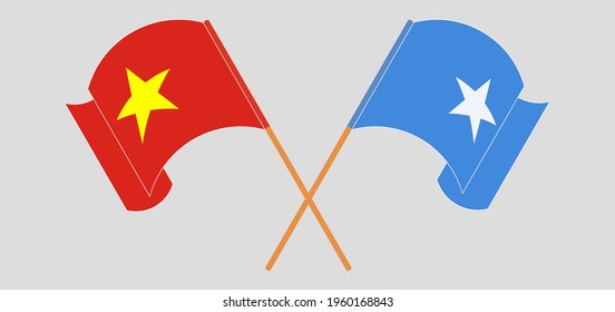 Crossed and waving flags of Vietnam and Somalia