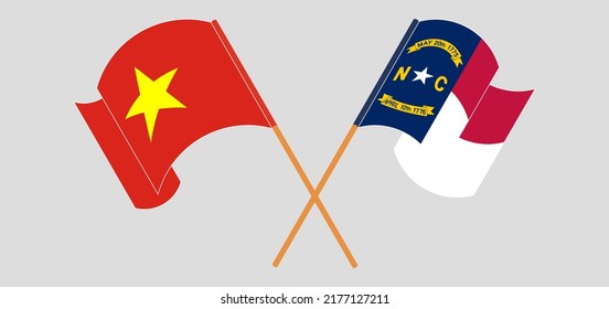 Crossed and waving flags of Vietnam and The State of North Carolina. Vector illustration
