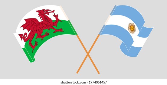 Crossed and waving flags of Wales and Argentina