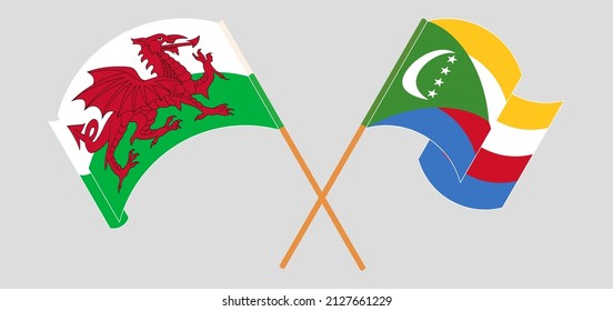 Banderas cruzadas y ondeando banderas de Gales y Comoras. Ilustración del vector
