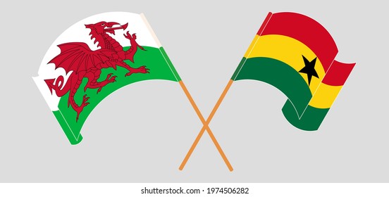 Crossed and waving flags of Wales and Ghana