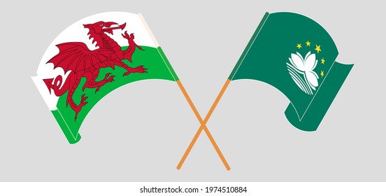 Crossed and waving flags of Wales and Macau