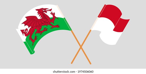 Crossed and waving flags of Wales and Monaco