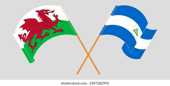 Crossed and waving flags of Wales and Nicaragua. Vector illustration
