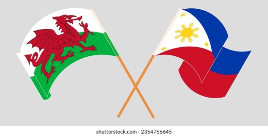 Crossed and waving flags of Wales and the Philippines. Vector illustration
