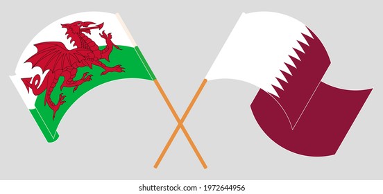 Crossed and waving flags of Wales and Qatar