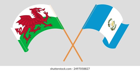 Crossed and waving flags of Wales and Republic of Guatemala. Vector illustration
