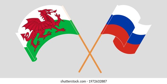 Crossed and waving flags of Wales and Russia