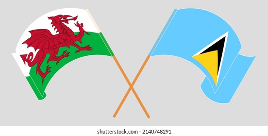 Cruzando y ondeando banderas de Gales y Santa Lucía. Ilustración del vector
