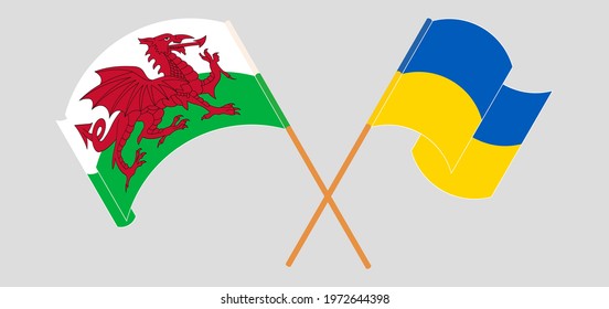 Crossed and waving flags of Wales and Ukraine