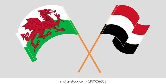 Crossed and waving flags of Wales and Yemen
