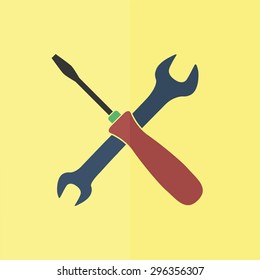 crossed wrench and screwdriver vector icon. Flat design