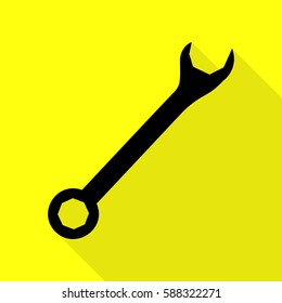 Crossed wrenches sign. Black icon with flat style shadow path on yellow background.