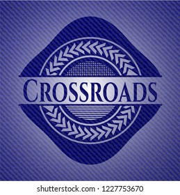 Crossroads badge with denim background