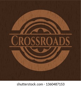 Crossroads badge with wooden background