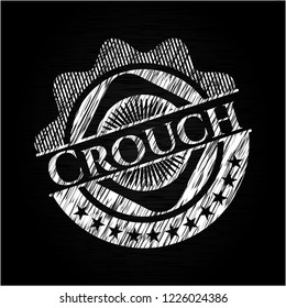 Crouch on chalkboard
