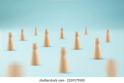 Crowd of people concept. Society concept. Many wooden figures standing on blue background