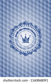crown icon inside blue emblem or badge with abstract geometric pattern background.