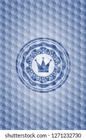 crown icon inside blue emblem or badge with abstract geometric pattern background.