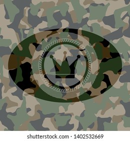 crown icon inside camouflage emblem