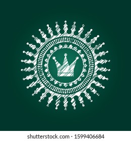 crown icon inside chalk emblem written on a blackboard