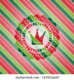 crown icon inside christmas badge.