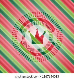 crown icon inside christmas emblem.