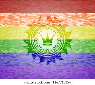 crown icon inside emblem on mosaic background with the colors of the LGBT flag