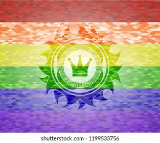 crown icon inside emblem on mosaic background with the colors of the LGBT flag