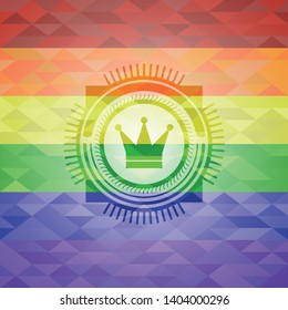 crown icon inside emblem on mosaic background with the colors of the LGBT flag
