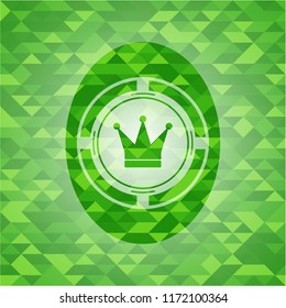 crown icon inside green emblem with mosaic background