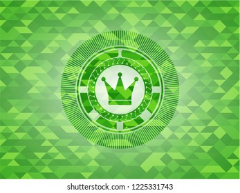 crown icon inside green emblem. Mosaic background