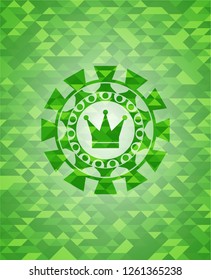 crown icon inside green emblem with mosaic background