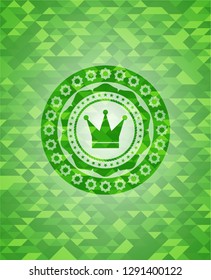 crown icon inside green emblem with triangle mosaic background