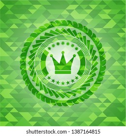 crown icon inside green emblem with mosaic background