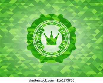 crown icon inside green mosaic emblem