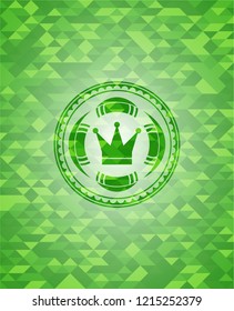 crown icon inside green mosaic emblem